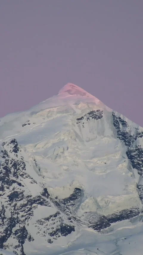 Dramatic fast motion view Majestic Tetnuldi peak sunlit by last sunset ligh.. Stock Footage 311656361