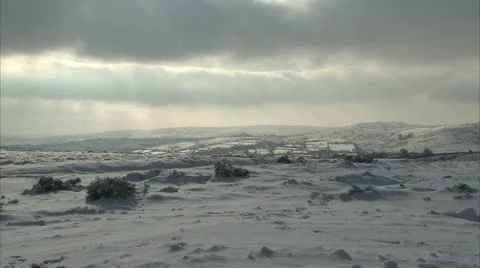 Dramatic fast moving clouds over snow laden Dartmoor Landscape Video stock 20943290
