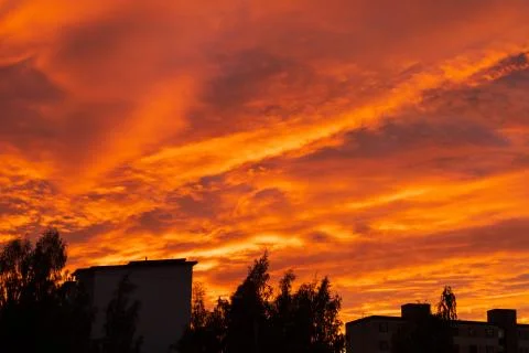 Dramatic fiery sky sunset cloudscape at dusk Stock Photos
