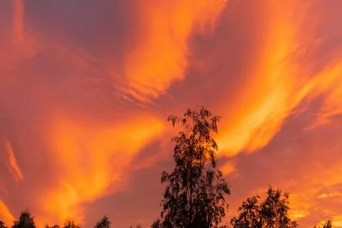 Dramatic fiery sky sunset cloudscape at dusk Stock Photos