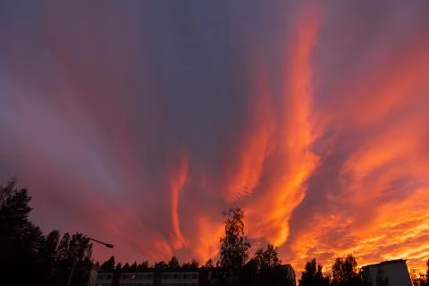 Dramatic fiery sky sunset cloudscape at dusk Stock Photos
