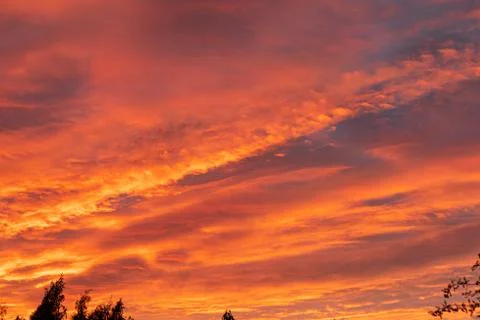 Dramatic fiery sky sunset cloudscape at dusk Stock Photos