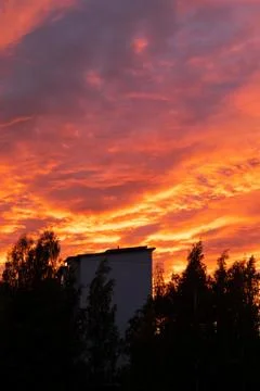 Dramatic fiery sky sunset cloudscape at dusk Stock Photos