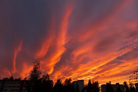 Dramatic fiery sky sunset cloudscape at dusk Stock Photos