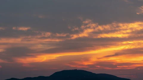 Dramatic Fiery Sunset Sky Over Mountain Silhouette – Time Lapse Footage Stock Footage 314471368
