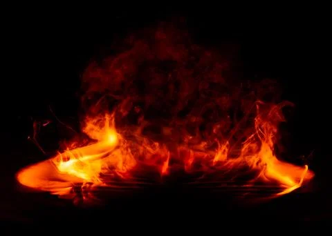 Dramatic fire and smoke effect glowing red and yellow colors exploding outw.. Stock Photos