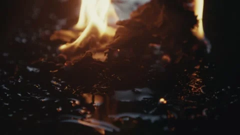 Dramatic Flames Dancing Over a Black Surface with a Stunning Reflection Effect Stock Footage 309543990