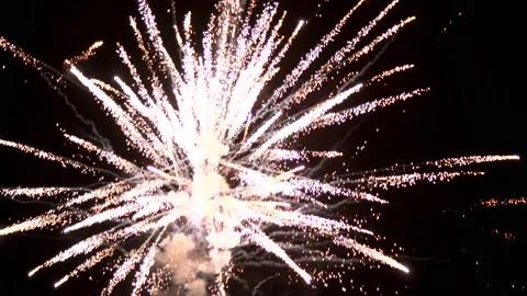 Dramatic flashing explosions of color and light from fireworks display at Stock Footage 155834588