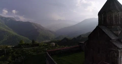 Dramatic flight in rays above gandzasar monastery in canyon. 426 2141 08 Stock Footage 130519281