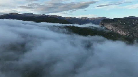 Dramatic Fog Roll Over Mountain Landscape and Green Hills View Stock Footage 341979771