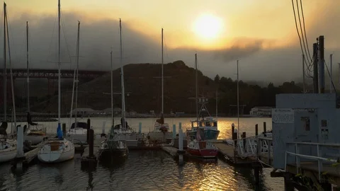 Dramatic fog rolls over mountains beyond sailboats docked in Horseshoe Bay Stock Footage 96705960