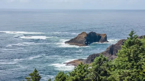 Dramatic Forested Headland on Oregon Coast 4K Footage of Trees and Ocean Bluff Stock Footage 309286533