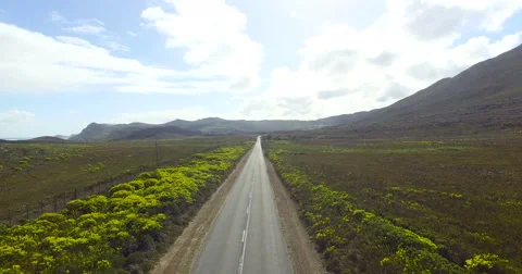 Dramatic forward flight over a long road in South Africa - 4K Drone Footage Stock-Footage 65300982
