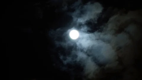 Dramatic full moon on night sky on cloudy day. Clouds run slow. Divination time. Stock Footage 108023756