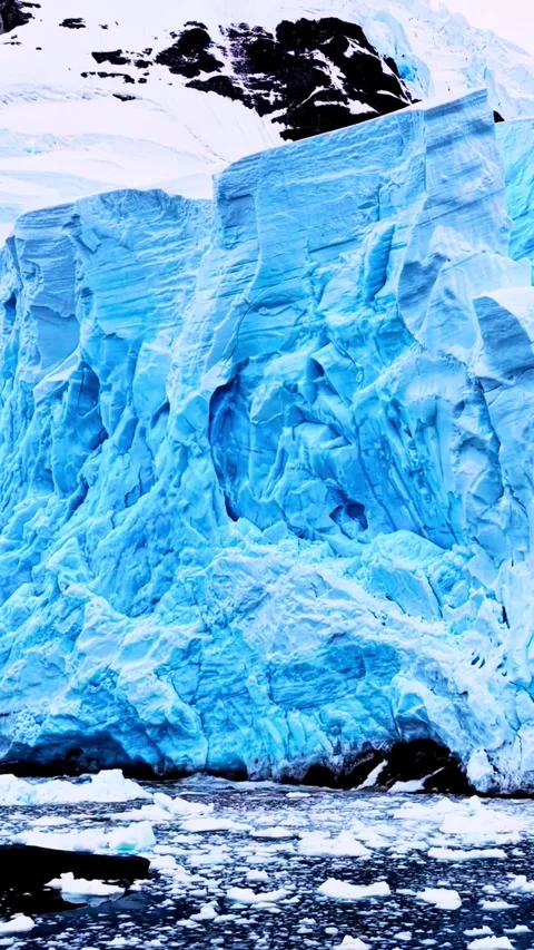 Dramatic glacier calving into icy antarctic waters majestic frozen landscap.. Stock Footage 331482248