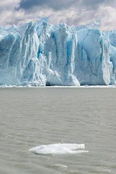Dramatic Glacier Wall and Iceberg in Patagonian Waters, Argentina Stock Photos