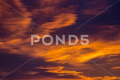 Dramatic glowing clouds in fiery orange at sunset,Calgary, Alberta, Canada Stock Photos