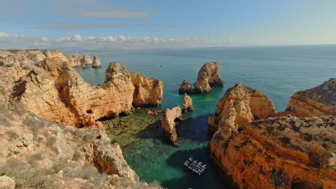 Dramatic Golden Cliffs of Ponta da Piedade in Portugal's Algarve Region Stock Footage 306661040