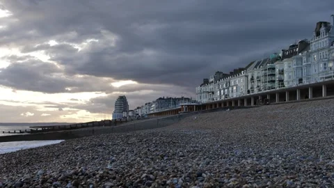 Dramatic golden sky at Hastings seaside in the UK slow motion 4K Stock Footage 285430716