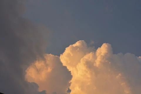 Dramatic golden storm clouds at sunset sky Stock Photos