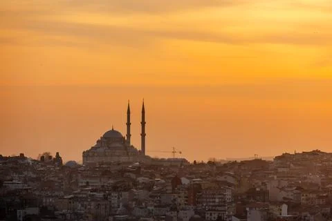 A dramatic golden sunset glowing over the mosque in Istanbul. Stock Photos