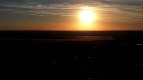 Dramatic Golden Sunset Over Dark Landscape Stock Footage 346789380