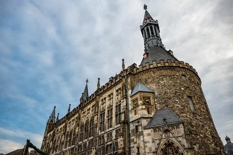 Dramatic Gothic Town Hall Facade and Tower Under Moody Winter Sky Stock Photos