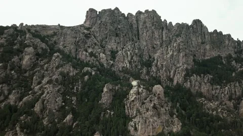 Dramatic granite peaks of Bavella Needles with pine forest, Corsica Vídeos de archivo 328300909