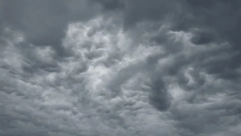 Dramatic gray clouds moving across overcast sky in timelapse motion Stock Footage 310307402