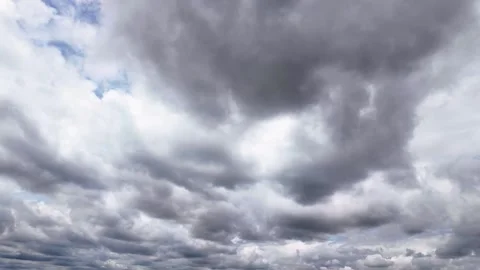Dramatic Gray Clouds Moving Across Blue Sky Timelapse Vídeos de archivo 339070493