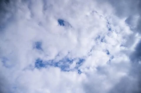 Dramatic Gray Clouds Over Blue Sky Stock Photos