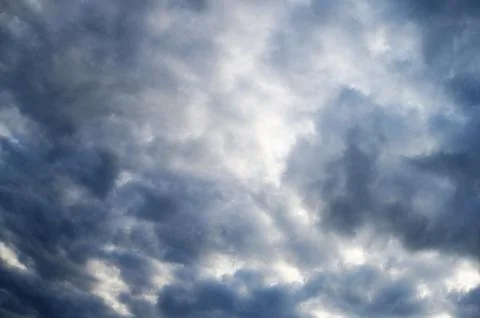 Dramatic Gray Clouds Over Blue Sky Stock Photos