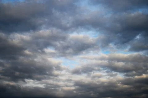 Dramatic Gray Clouds Over Blue Sky Stock Photos