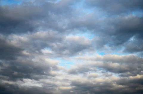 Dramatic Gray Clouds Over Blue Sky Stock Photos