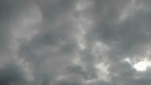 Dramatic gray clouds slowly drift by 動画素材 99845447