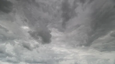 A Dramatic Gray Cloudy Sky with Intricate Swirling Patterns Creating a Striking Stock Footage 313350269