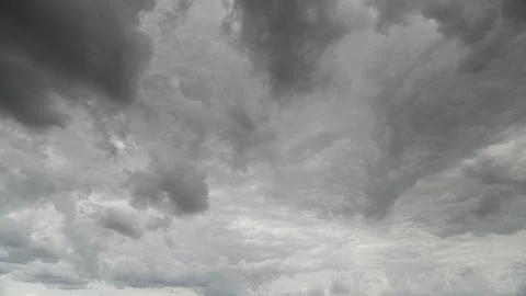 A Dramatic Gray Cloudy Sky with Intricate Swirling Patterns Creating a Striking Stock Photos
