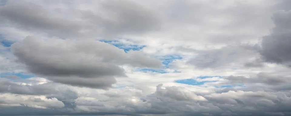 Dramatic Gray Storm Clouds with Blue Sky Stock Photos