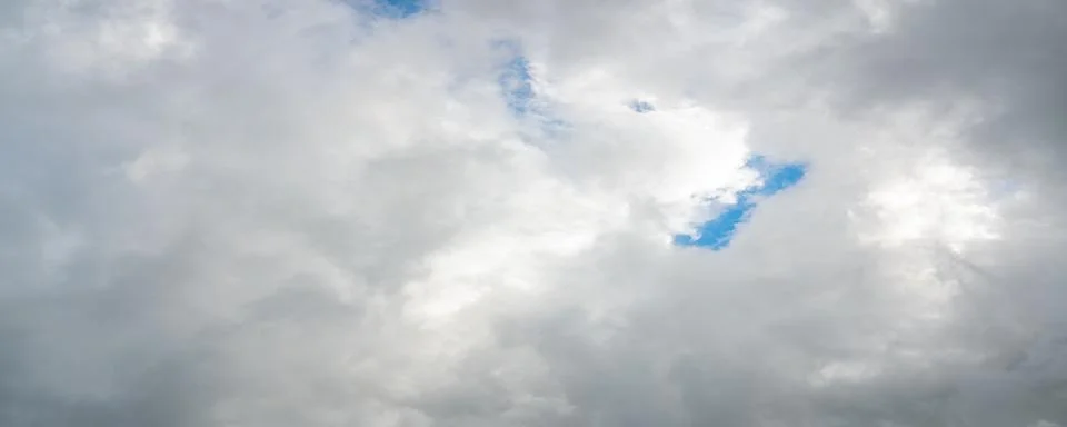 Dramatic Gray Storm Clouds with Blue Sky Stock Photos