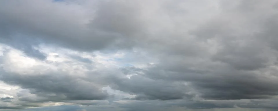 Dramatic Gray Storm Clouds with Blue Sky Stock Photos
