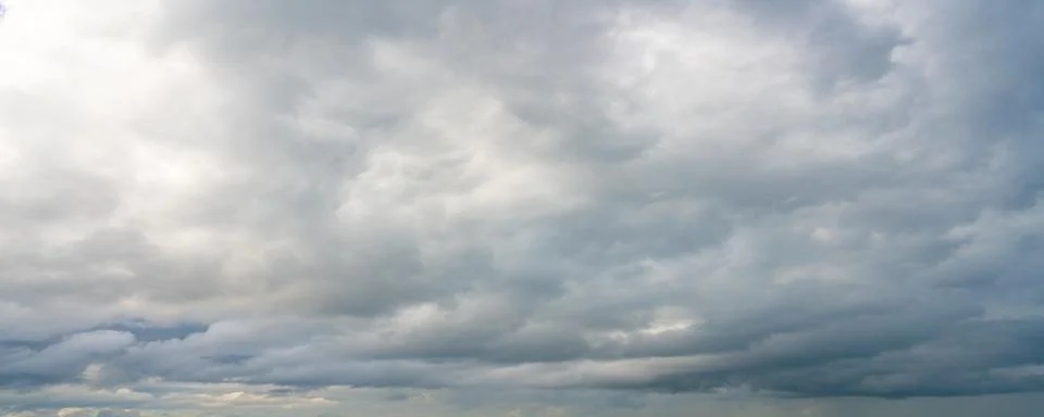 Dramatic Gray Storm Clouds with Blue Sky Stock Photos