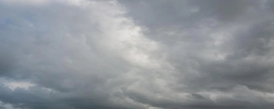 Dramatic Gray Storm Clouds with Blue Sky Stock Photos