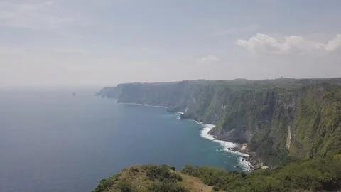 Dramatic green cliff on the ocean cost ocean horizon aerial footage Stock Footage 101838375
