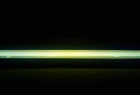 Dramatic green illuminated lamp background Stock Photos