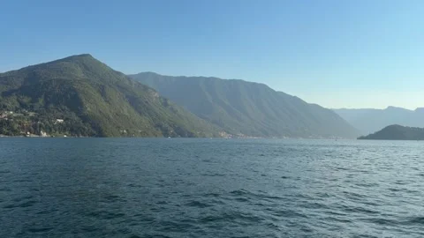 Dramatic Green Mountains Rising Above Blue Alpine Lake Stock Footage 346505935
