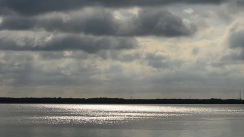 Dramatic grey clouds over water Stock Footage 72130137