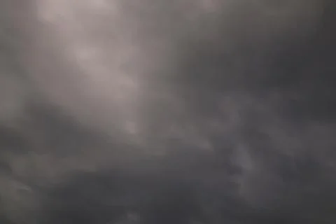 Dramatic grey sky with various cloud formations creating a dynamic pattern 스톡 사진