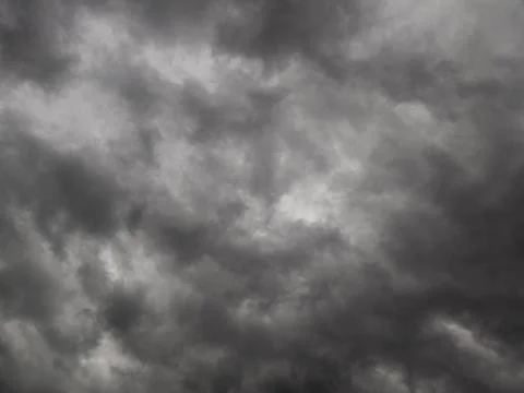 Dramatic grey storm clouds background upward view from ground Stock Photos