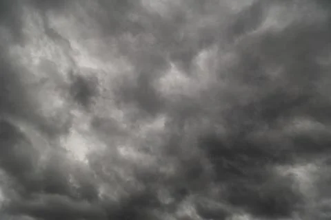 Dramatic grey storm clouds background upward view from ground Stock Photos