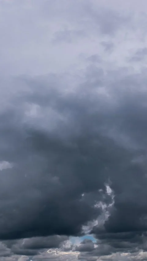 Dramatic Grey Storm Clouds Rolling Across Dark Sky in Time Lapse Stock Footage 337454294